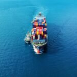 Free Photo _ Aerial view of cargo ship with cargo container on sea